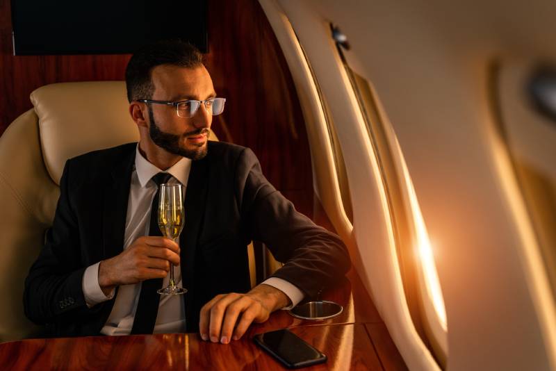 A man seated aboard a private aircraft