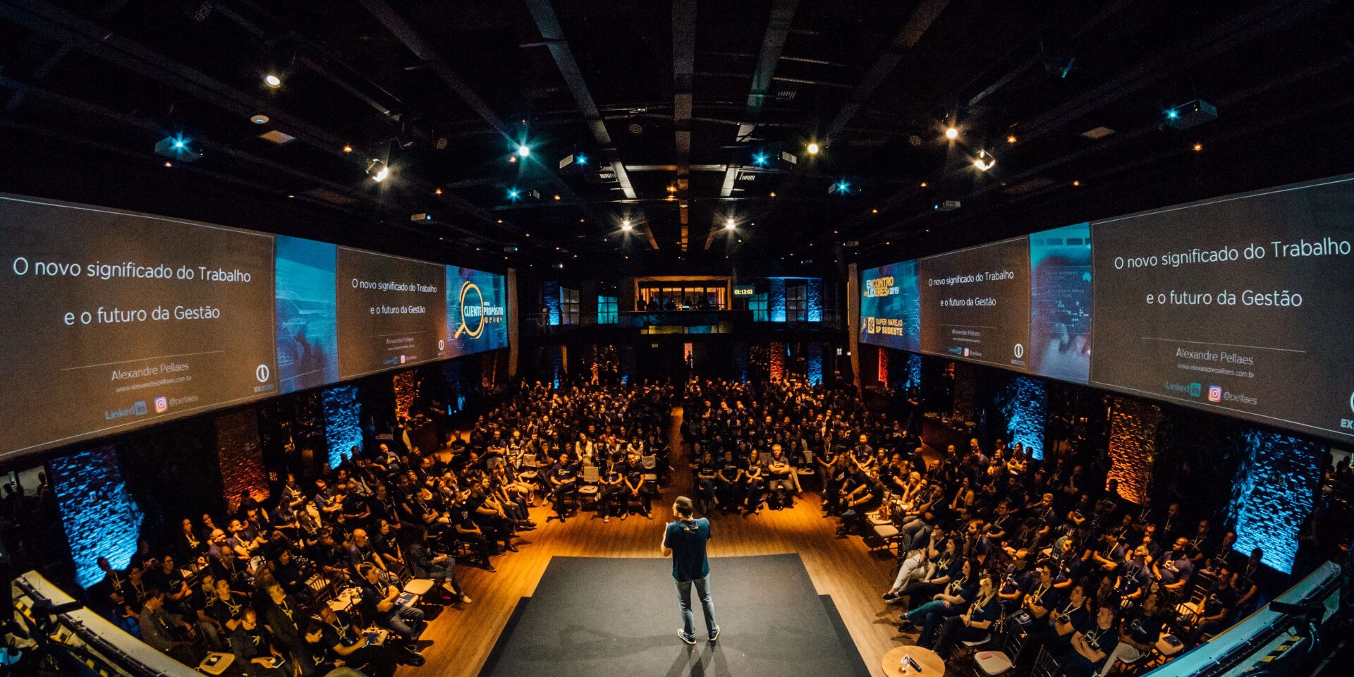 A speaker on stage at a live workshop